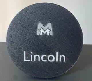 Round base with a name printed on it