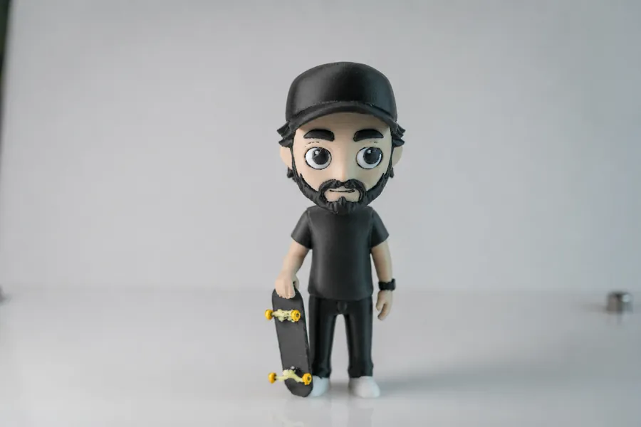 The finished 3D-printed birthday MiniMe figurine holding a skateboard