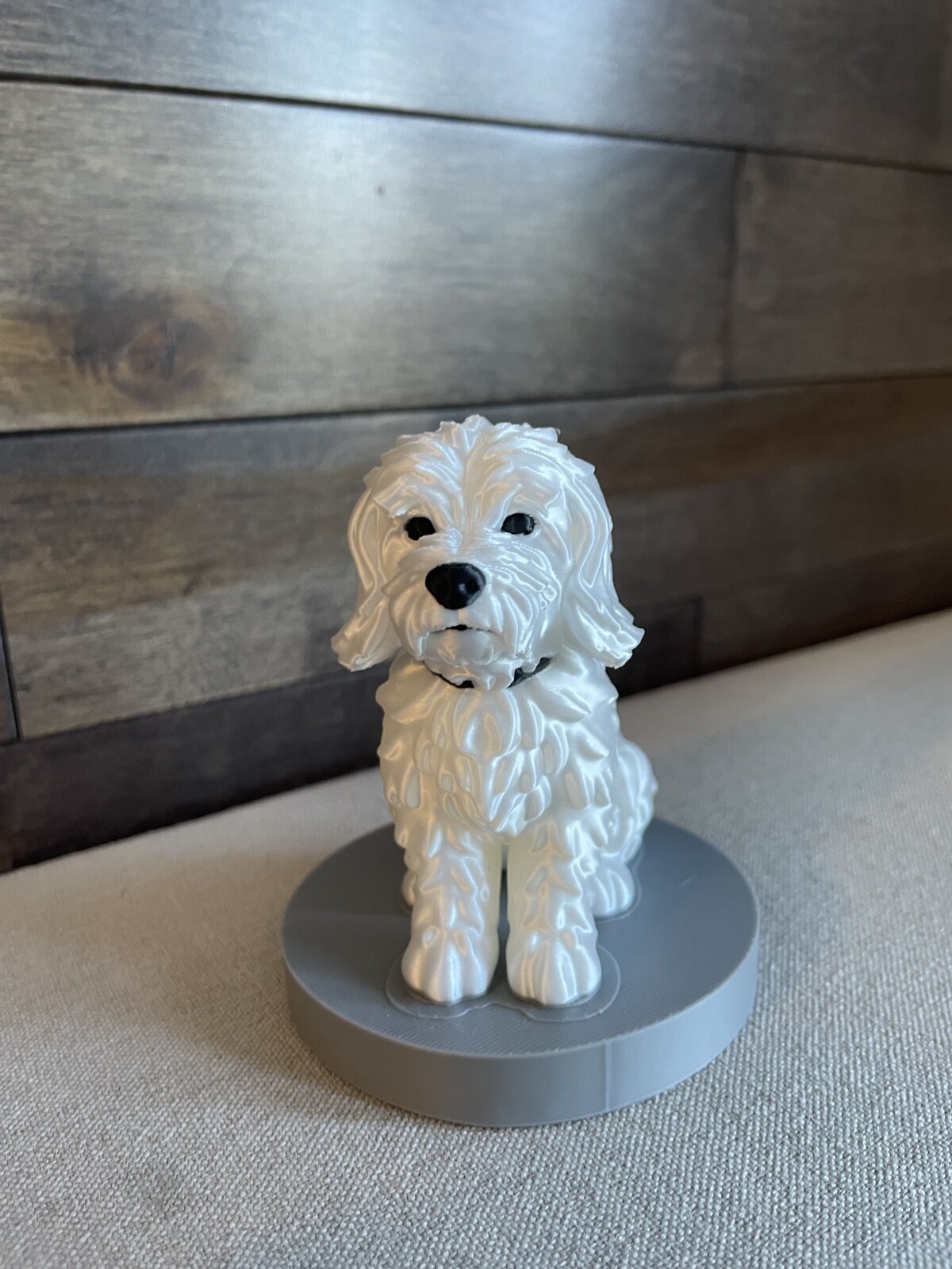 The finished 3D-printed pet MiniMe figurine of the white dog